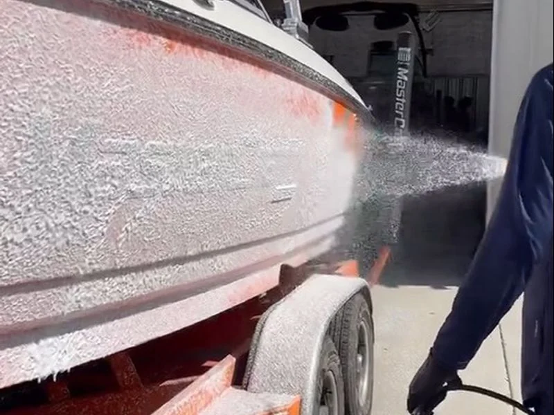 Foam wash on a boat hull during mobile detailing