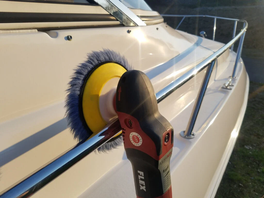 Boat polishing with a buffer during detail work